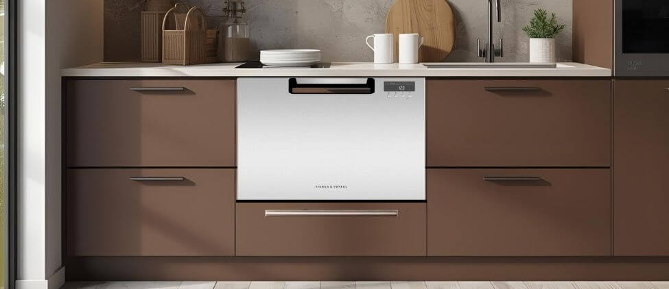 Fisher & Paykel DD24SAX9N dishwasher review showing a stainless steel single DishDrawer seamlessly built into a modern brown kitchen cabinet.