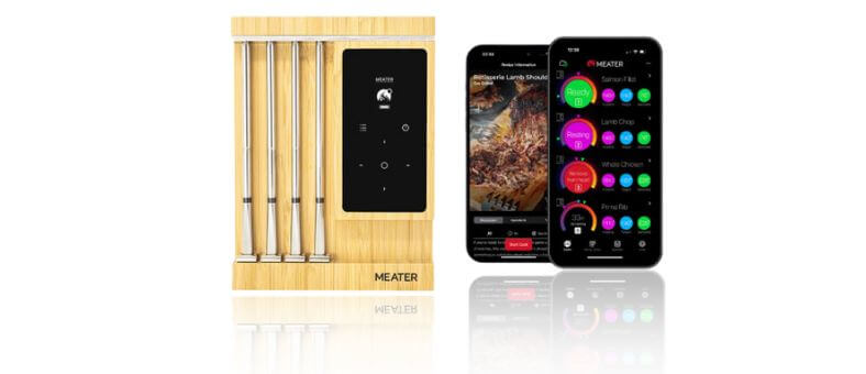 A MEATER Pro smart meat thermometer set with four stainless steel probes and smartphone app displaying temperature tracking and cooking progress.