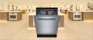 In this BOSCH SHP65CM5N Dishwasher Review image, the built-in (under-counter) dishwasher is displayed in a showroom setting, highlighting its modern design and sleek front panel.
