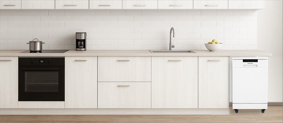 A sleek, modern kitchen featuring minimalistic cabinetry and polished surfaces. Positioned neatly in the corner, the freestanding Hamilton Beach HBDW1922dishwasher blends convenience with flexibility, showing how well it fits into a functional yet dynamic kitchen space.