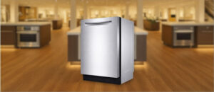 Feature image of Bosch SHPM78Z55N Dishwasher Review: The image shows the built-in (under-counter) dishwasher is placed in an appliance showroom, displaying the dishwasher’s refined and modern look, with a streamlined front panel and stylish build that complements today’s kitchens.